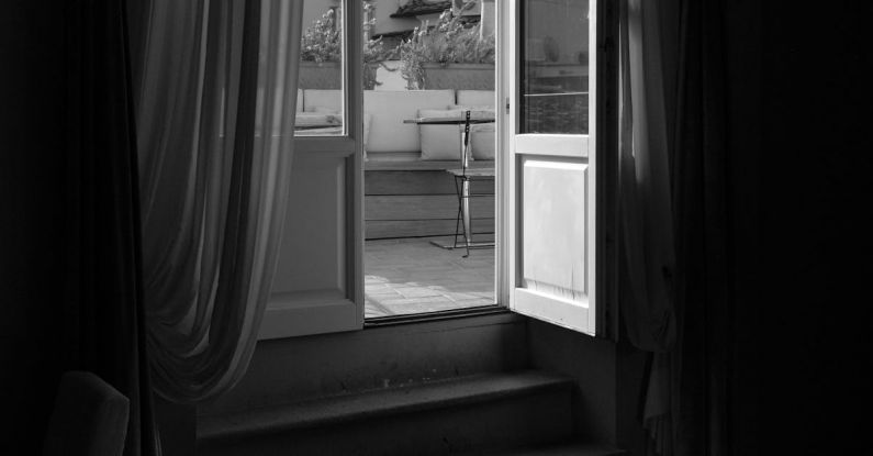 Open Rates - A black and white photo of a window with a view