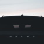 Brand Consistency - The rear end of a volvo car at sunset